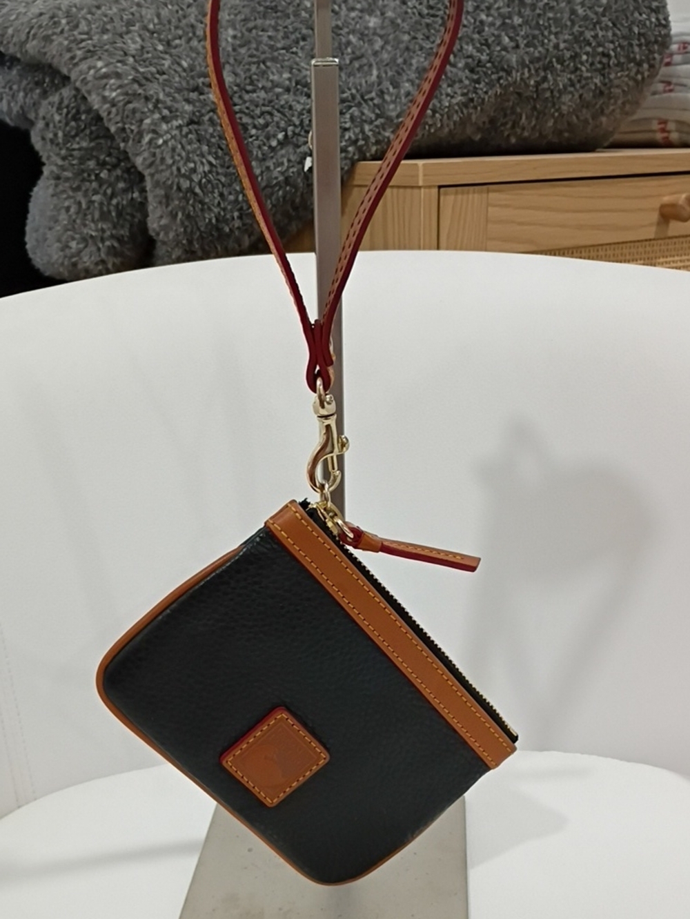 Dooney & Bourke Black and Tan Pebbled Leather Wristlet Pouch